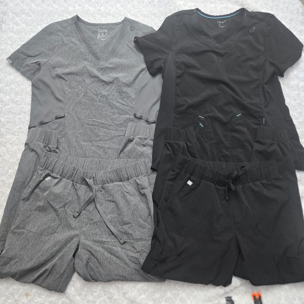 2 sets of scrubs both tops Large Both Pants Medium